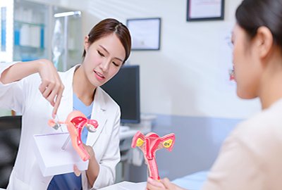 doctor_with_utherus_toy_post_vaginoplasty_in_turkey