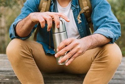 man_hydrating_after_piezo_rhinoplasty_in_turkey