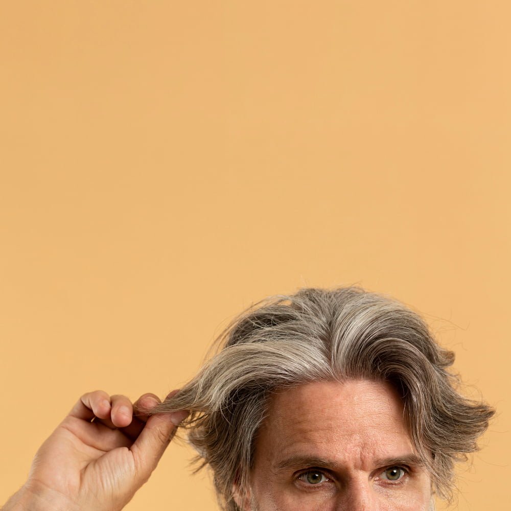 man_showing_amazing_hair_after_hair_transplant_in_turkey