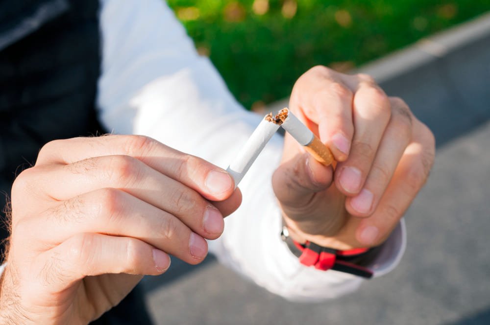 non_smoker_breaking_cigarette_stick_for_liposuction_in_turkey