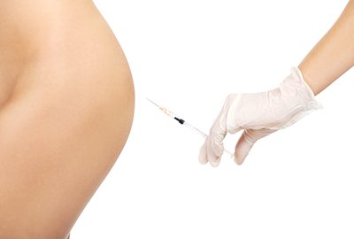 surgeon_administering_liquid_bbl_to_patient