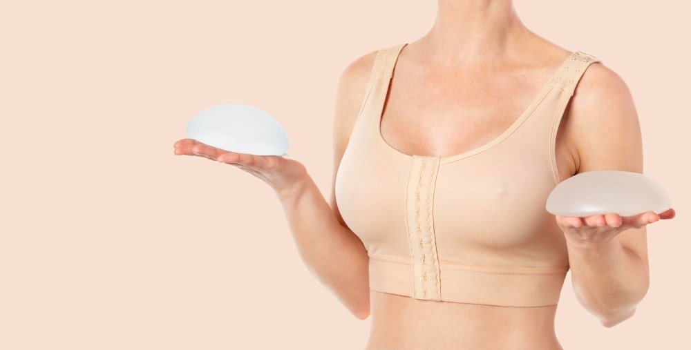 woman_holding_two_implant_options