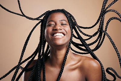 woman_with_braids_after_afro_hair_transplant_in_turkey