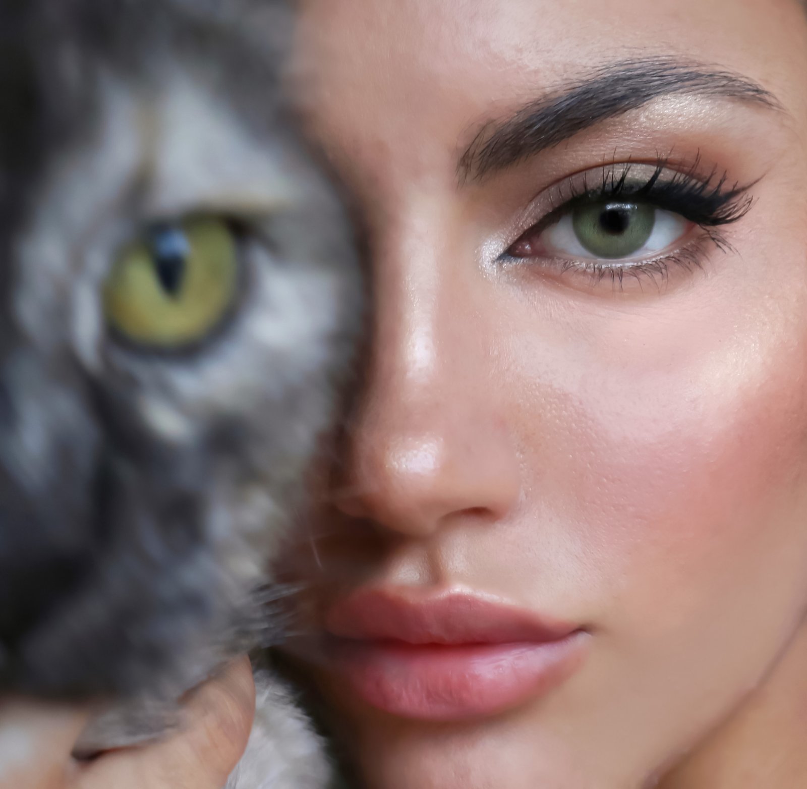 woman_with_cat_eye_holding_a_cat